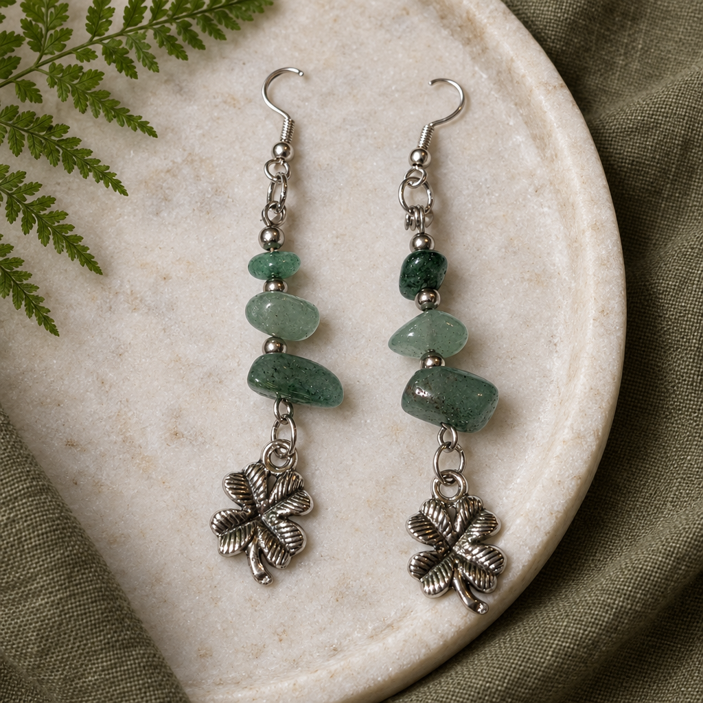 Aventurine clover earrings on a stone tray