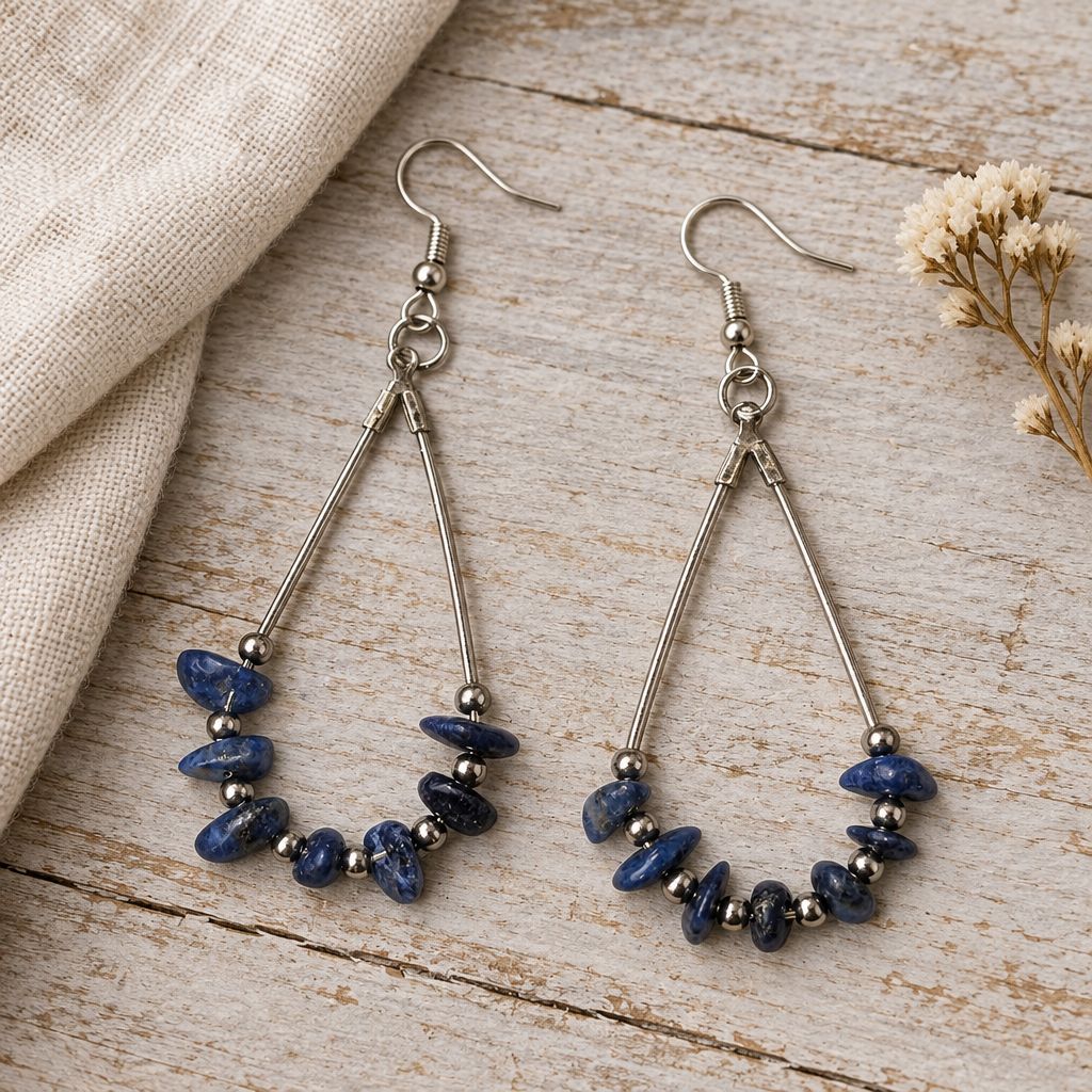 Blue earrings on natural wood