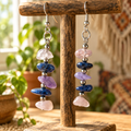 Earrings hanging by a sunlit window