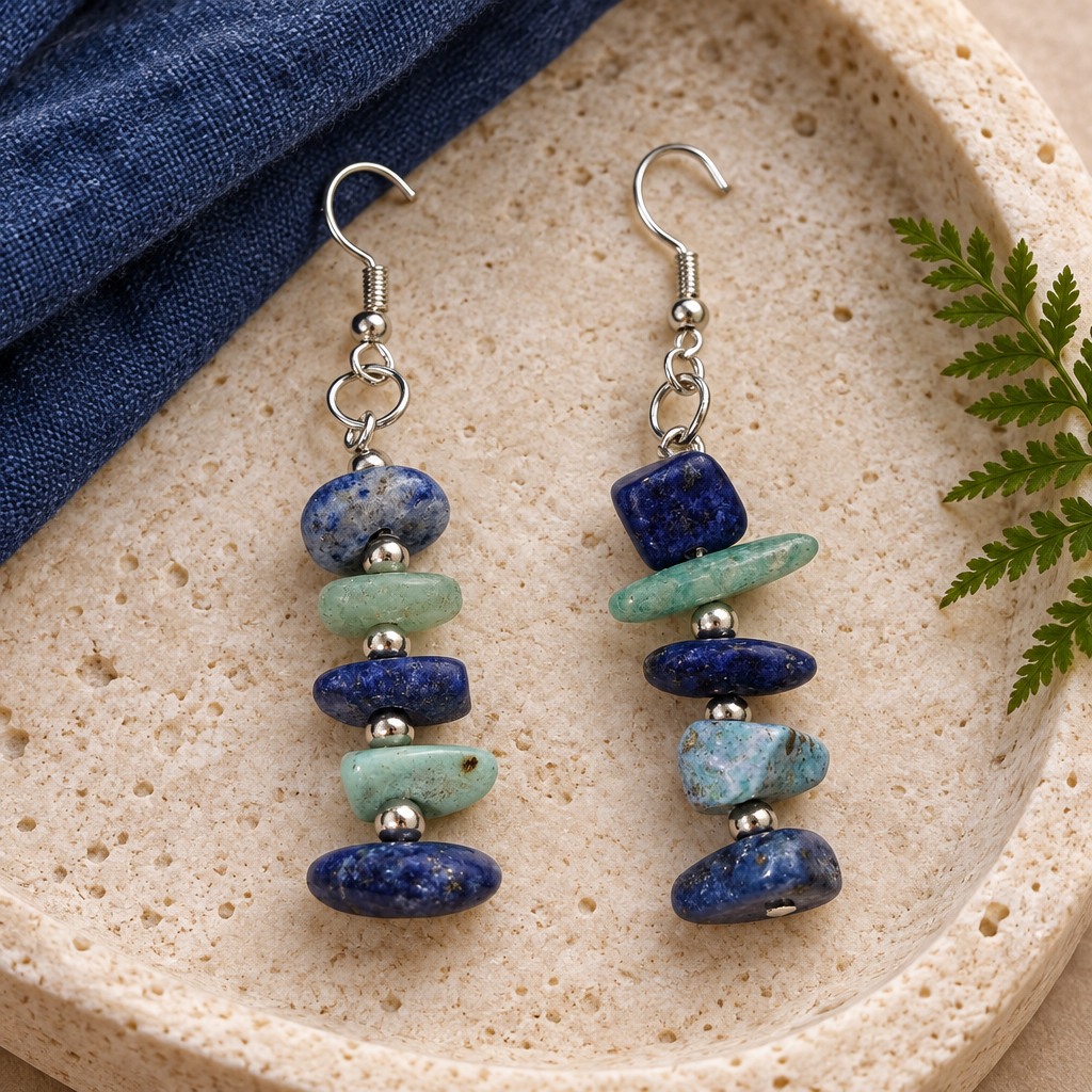 Earrings on a pale stone tray