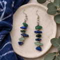 Earrings on a stone tray
