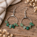 Earrings styled on natural wood