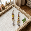 Fall Pinecone earrings on linen and sandstone