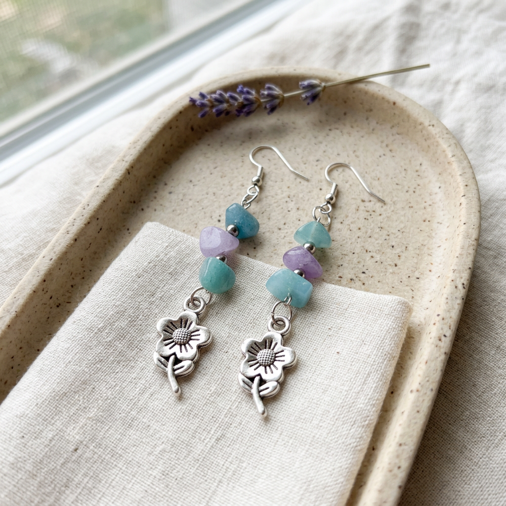 Flower earrings on ivory linen and sandstone