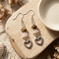 Heart earrings styled on natural wood