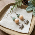 Moss and Stone Blossom earrings on ivory linen