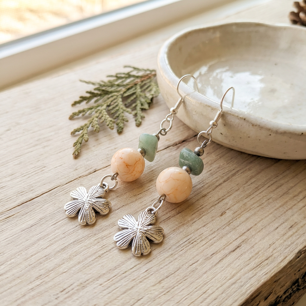 Moss and Stone Blossom earrings styled on natural wood