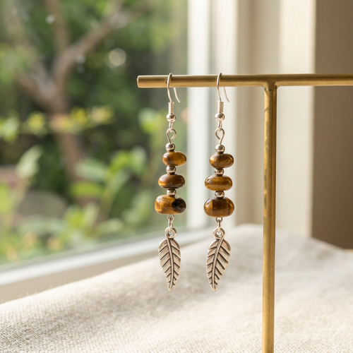Woodland Feathers earrings on a jewelry stand